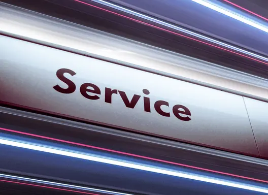 brightly lit sign that reads "Service"