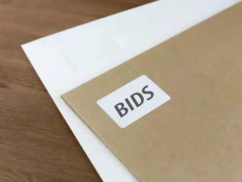 white and brown envelopes with bids label