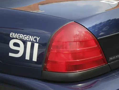 "Emergency 911" written on the back of an emergency vehicle