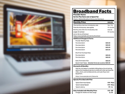 Broadband label with laptop in the background.
