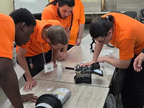 students splicing fiber