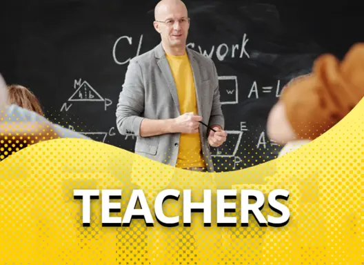 teacher in front of a classroom chalkboard