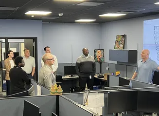 Students looking at screens at the Iowa Communications Network office.
