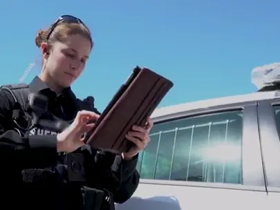 police woman using a tablet computer