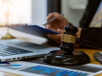 Person working with a laptop in a law office